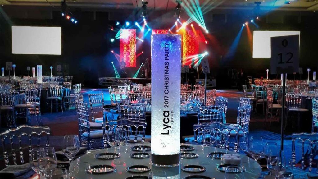 A branded corporate table centrepiece with a logo and ice.