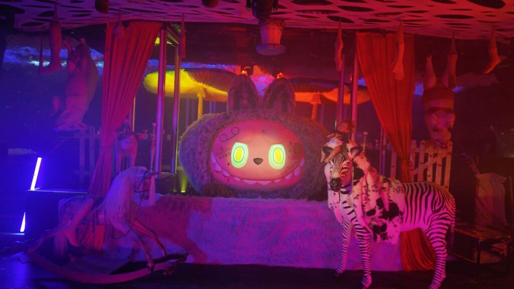 Fever Dream stage design complete with large prop and lighting.