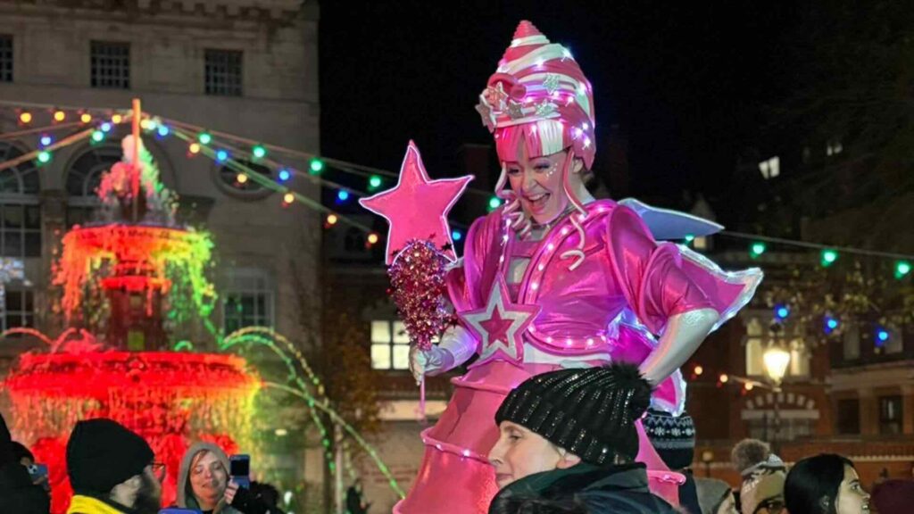 Our pink fairy stilt walker at a Christmas market.