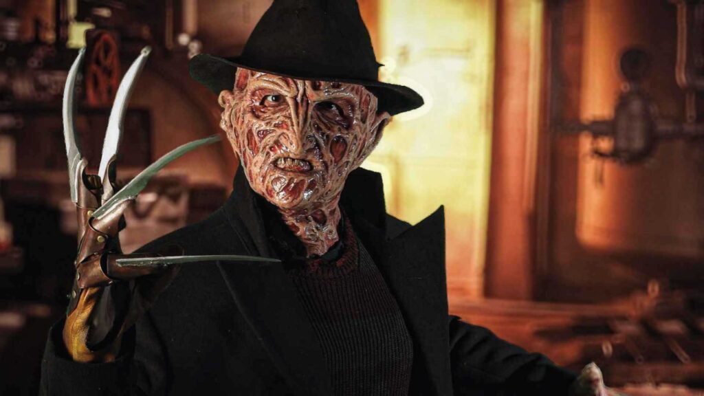 Freddy Krueger impersonator performing at a Halloween event.