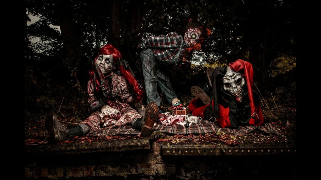 Toys of Torture doll performers in costume at a Halloween scare attraction.
