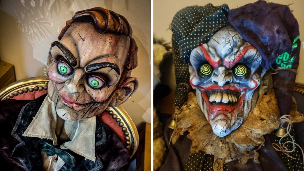 Two haunted doll walkabout performers in detailed costume and mask.