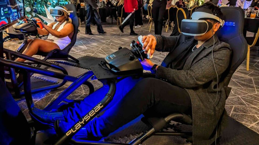 Guests racing head to head on interactive F1 simulators at a brand activation