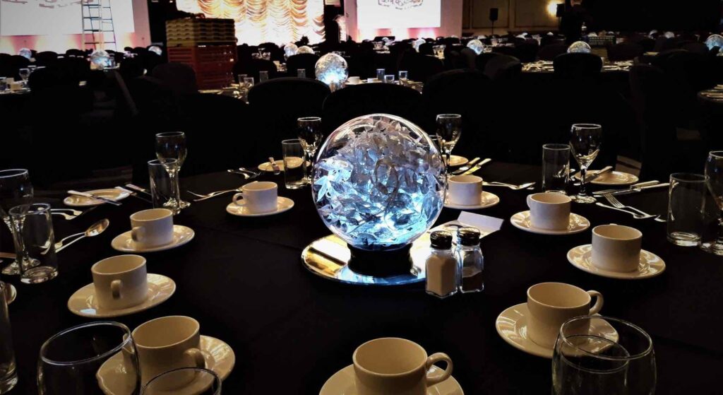 A silver leaf globe table centrepiece, perfect for Christmas events.
