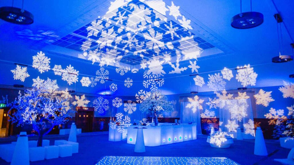 Cohesive event space where lighting, decor and staging carry a single unified brand narrative