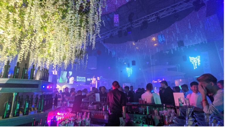 Immersive branded event environment with custom set design and atmospheric lighting