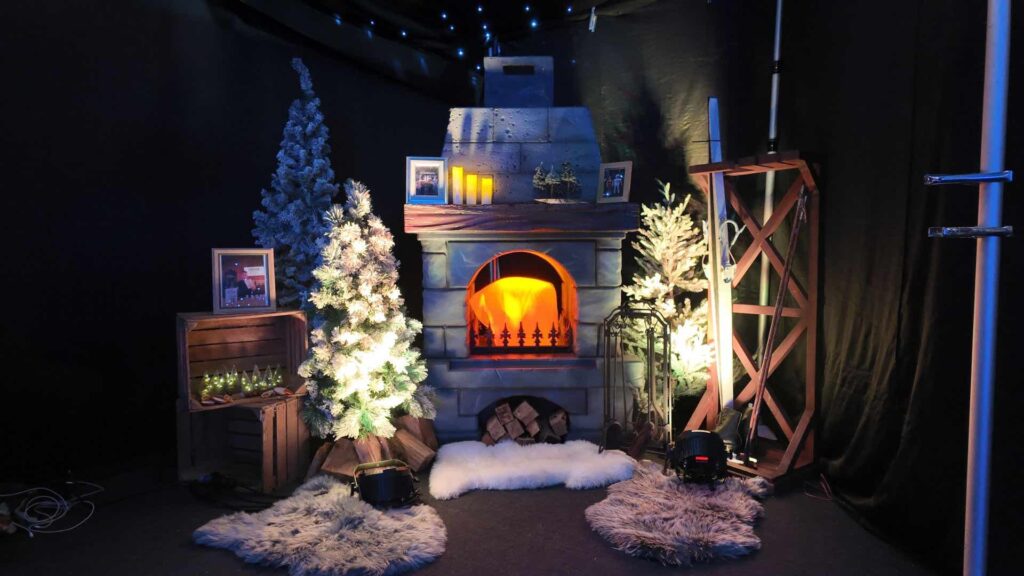 Alpine lodge photo booth scenery with fireplace and skis