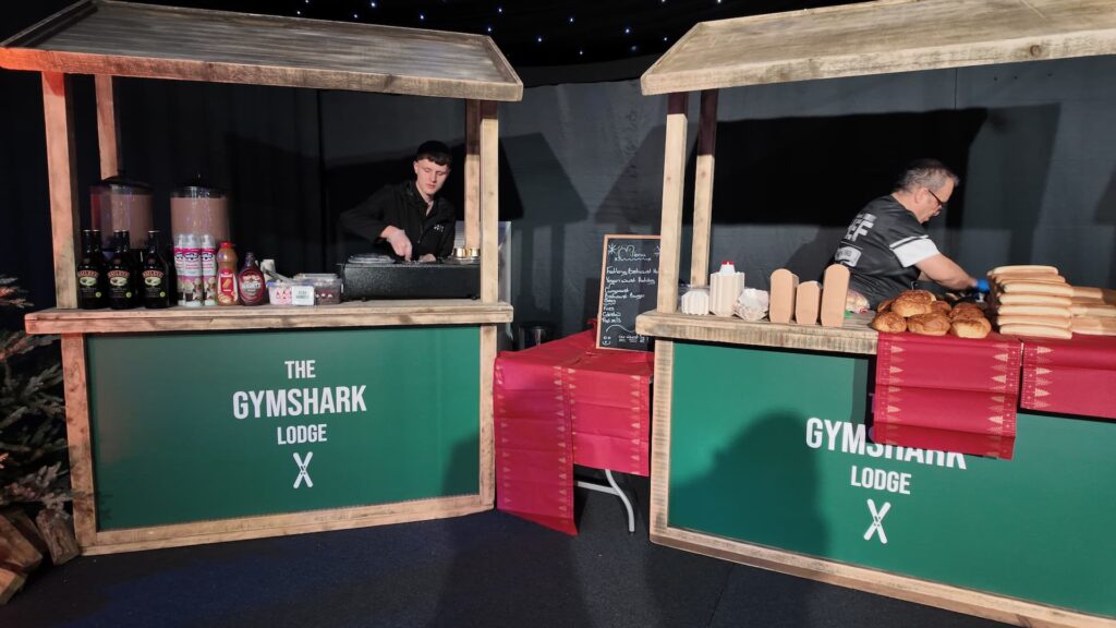 Branded Gymshark Lodge food stalls at a corporate Christmas party