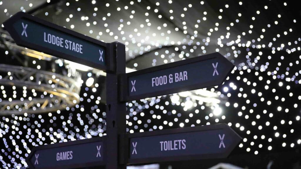 Alpine themed directional event signage at a corporate Christmas party