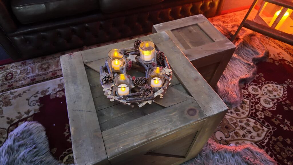 Rustic Christmas table styling with candles and pinecones