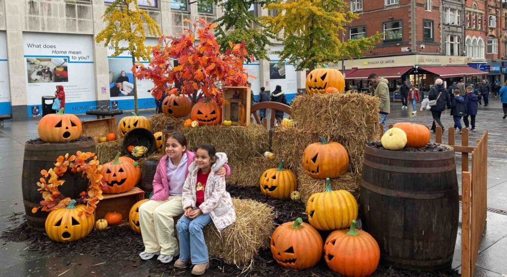 Pumpkin patch Halloween installation created for Liverpool BID with visitors posing for photos