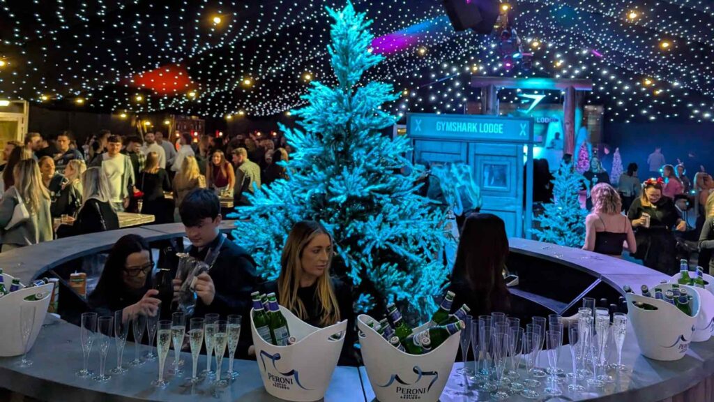 Branded ice bar at an alpine lodge themed corporate event with après-ski styling.