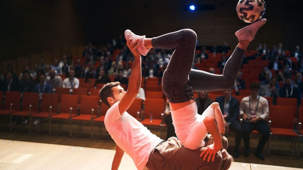 Football freestyle duo performing in front of fans