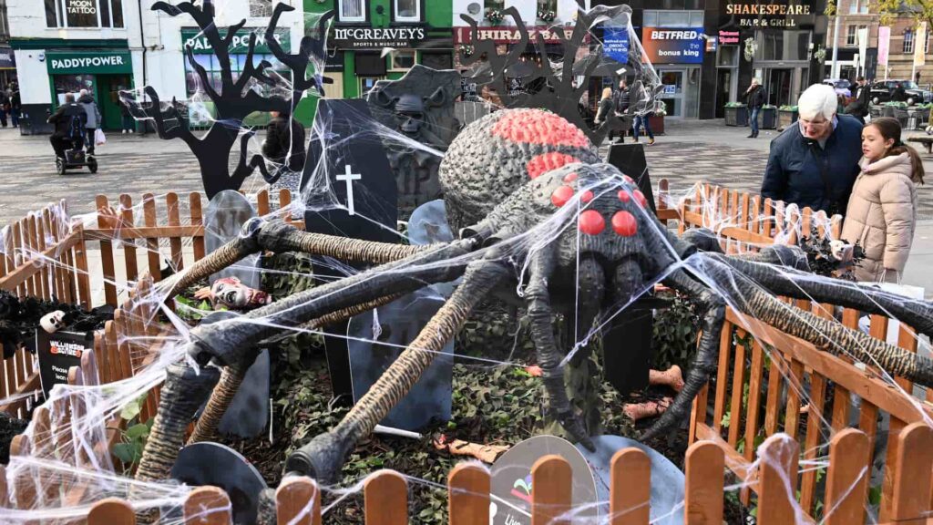 Giant spider graveyard Halloween installation created for Liverpool BID in a city centre public space