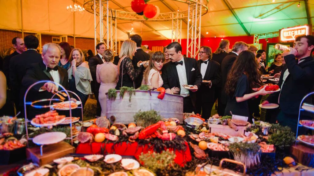A grazing-style station keeps guests moving so catering never competes with speeches or entertainment.