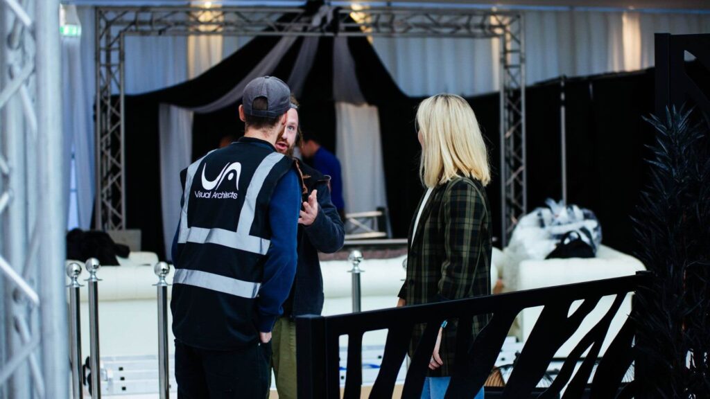 Event management team reviewing venue floor plan and security planning documents