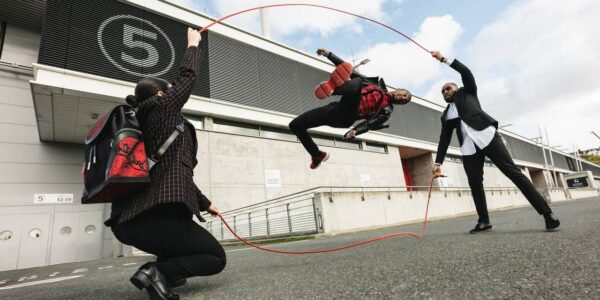 Double-Dutch-Performer-Jumping-Outside-Stadium