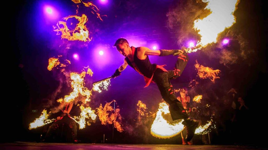 Grid of bespoke event entertainment including fire dancers, UV dancers, a magician, live music and aerial acts