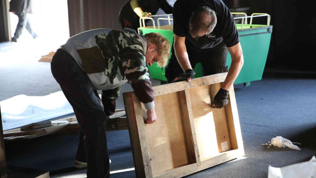The team putting together props and furniture on site at GYMSHARK Christmas party managed by Julia Charles.