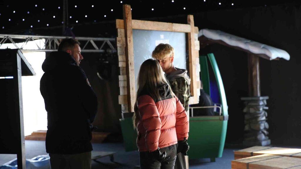 Julia Charles event team discussing on-site supplier coordination during the Gymshark Christmas event build