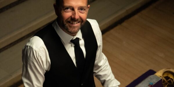 Pool-Trick-Shot-Artist-Leaning-On-Table