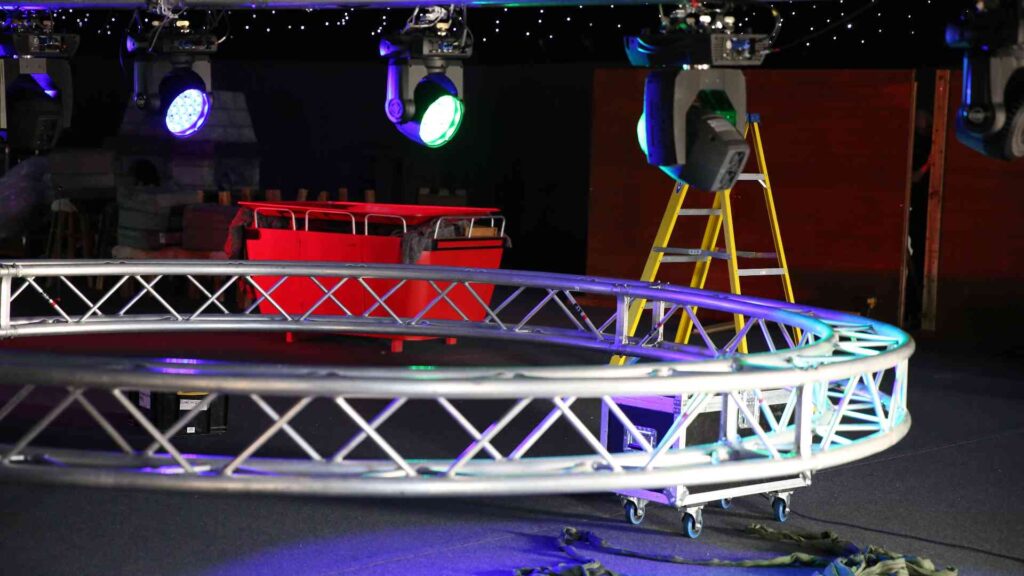 Circular lighting truss being installed by event production suppliers inside the Gymshark Christmas venue