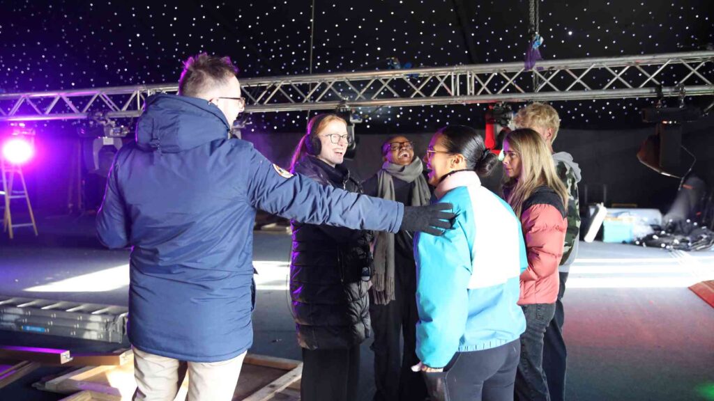 Event management team coordinating suppliers during an on-site event briefing